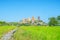 View of Wat Tham Sua with rice field and blue sky on background, Tiger cave temple most popular temple in Kanchanaburi , Thailand