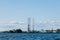 View from the water on the coastline of Kronstadt, cargo ships,Floating drilling rig, drilling cranes. Russia, Kronstadt
