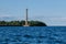 View from the water of the Kronstadt lighthouse, the coastline of Kronstadt, the waters of the Gulf of Finland, the blue