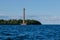 View from the water of the Kronstadt lighthouse, the coastline of Kronstadt, the waters of the Gulf of Finland, the blue