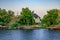 A view from the water of a suburban settlement on the coast of the Konka River in the Kherson floodplain Ukraine. Private houses