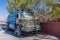 A view of a water tanker lorry parked in the desert beside the Jordan Valley highway