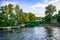 View from the water to a settlement on the coast of the Konka River in Kherson Ukraine. Country house among summer greenery and