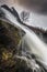 View on waterfall on Fluo river, dropping down to Innerdalen valley, Trollheimen mountains, norwegian national park