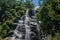 View of waterfall in the middle of the forest at the Itatiaia Park.