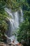 View of waterfall and people in the Itatiaia Park.