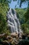 View of waterfall and people in the Itatiaia Park.