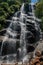 View of waterfall and people in the Itatiaia Park.