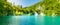 View of waterfall at Plitvice lakes, Croatia. Panoramic view of fresh nature, blue water and green trees