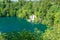 View of waterfall at Plitvice lakes, Croatia. Panoramic view of fresh nature, blue water and green trees