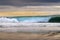 View of a wave breaking at the Carcavelos Beach