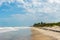 View of waves reaching the dunes in desert sandy beach in the northeastern coast of Brazil