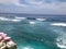 The view of waves and surfers from the cliff of Uluwatu, Bali, Indonesia