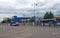 a view of wellington road in ashton under lyne showing retail outlets and people waiting for buses