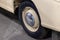 View of the wheel with disk of the old Russian car of the executive class released in the Soviet Union beige GAZ m-20 pobeda