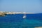 View on a white boat and the beach Alcaufar on Menorca