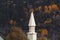 View of the white chapel, steeple in Dog Mountain, St. Johnsbury, VT, foliage, during autumn