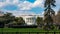 View of the White House, presidential residence and Oval Office from the south lawn in Washington DC with iron security fence in