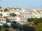 View of white houses with orange roofs in the Portuguese coastal town Sines