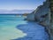 View on of white rock steep cliff volcanic bay of Cape Drastis and Peroulades area with tropical deep turquoise clear sea, green