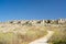 View of the White Rocks buildings from an open field in Pembroke, Malta