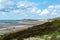 View on white sandy  beach, dunes and water of North sea between Vlissingen en Domburg, Zeeland, Netherlands