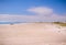 View of a white sandy beach lined with houses, Cape Town