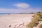 View of a white sandy beach lined with houses, Cape Town