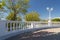 View on white stone fence with balusters from Black sea promenade on sunny early autumn day in Velvet season. Gelendzhik