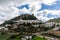 View of the whitwashed Andalusian village of Zahara de la Sierra and its Moorish Castle on the hilltop