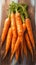 view Wholesome image vibrant carrots gathered in a bunch on wood