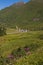 View of wild pink flowers and little alpine village in Val Formazza