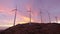 View of the wind farm in the mountains at sunset