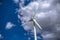 View of a wind turbine on top of mountains