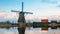 View of Windmill and reflection in Kinderdijk Village