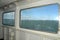 View through window of chain ferry, Poole harbour near Sandbanks, Dorset