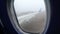 View from the Window of a Jet Passenger Aircraft Maneuvering along the Runway into the Fog