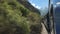 The view from the window of a peru rail train from machu picchu