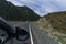 view from the window of the road, blue sky and mountains while driving while traveling in Altai