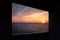 View through the window of the sea horizon at sunset time. setting sun in the sea