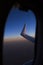 View from window seat during flight. Blue sky at sunrise. Wing. Airplane. Travel concept