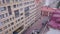 View at windows of business buildings and red roof. Clip. Top view of modern office building with red roof in cloudy