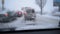 View through windshield on defocused scene on snowy city road