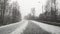 View through the windshield on the highway in winter along which the car is driving in heavy snow and wind in Russia.