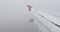 View on the wing of an airplane during a flight in dense clouds