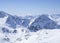 View on winter landscape from the top of Schaufelspitze mountain at Stubai Gletscher ski area with snow covered peaks at