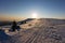 View of a winter mountain landscape with a beautiful sunset above the valley