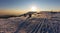 View of a winter mountain landscape with a beautiful sunset above the valley