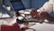 View of woman`s hands testing motherboard in laboratory