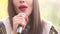 View of woman\'s mouth with red lipstick, smiling and singing with microphone